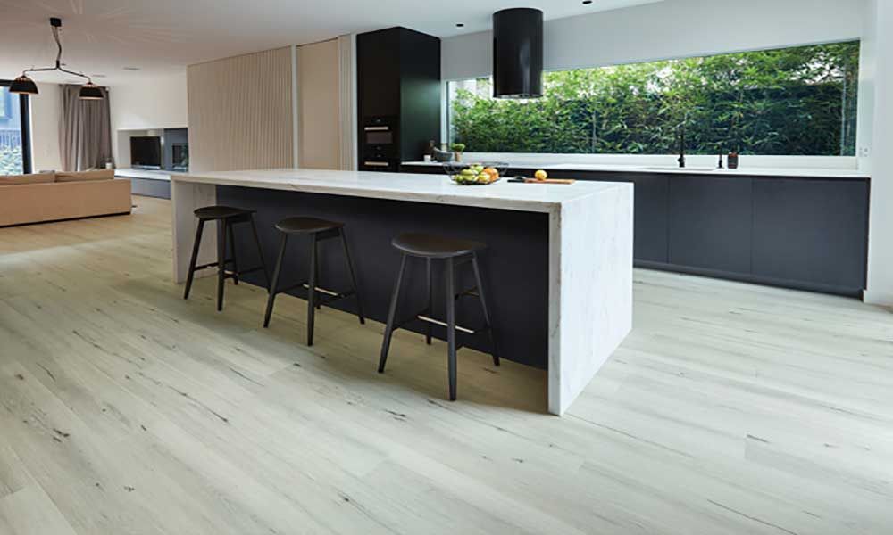 A spacious kitchen floor covered in Heartridge flooring.