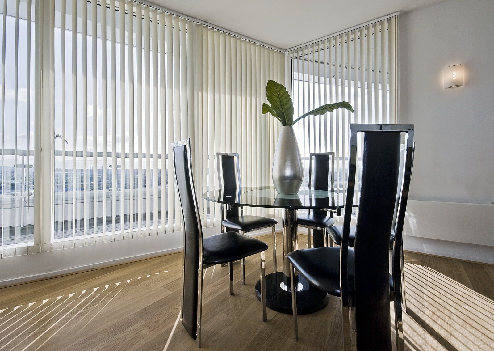 stylish modern dining room with vertical blinds